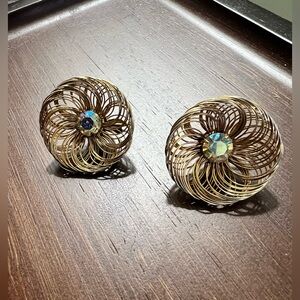 Vintage SAC gold tone spun wire with AB rhinestone center paddle back earrings.